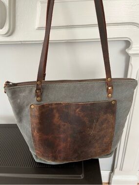 Gray waxed canvas tote with worn Brown Leather accents